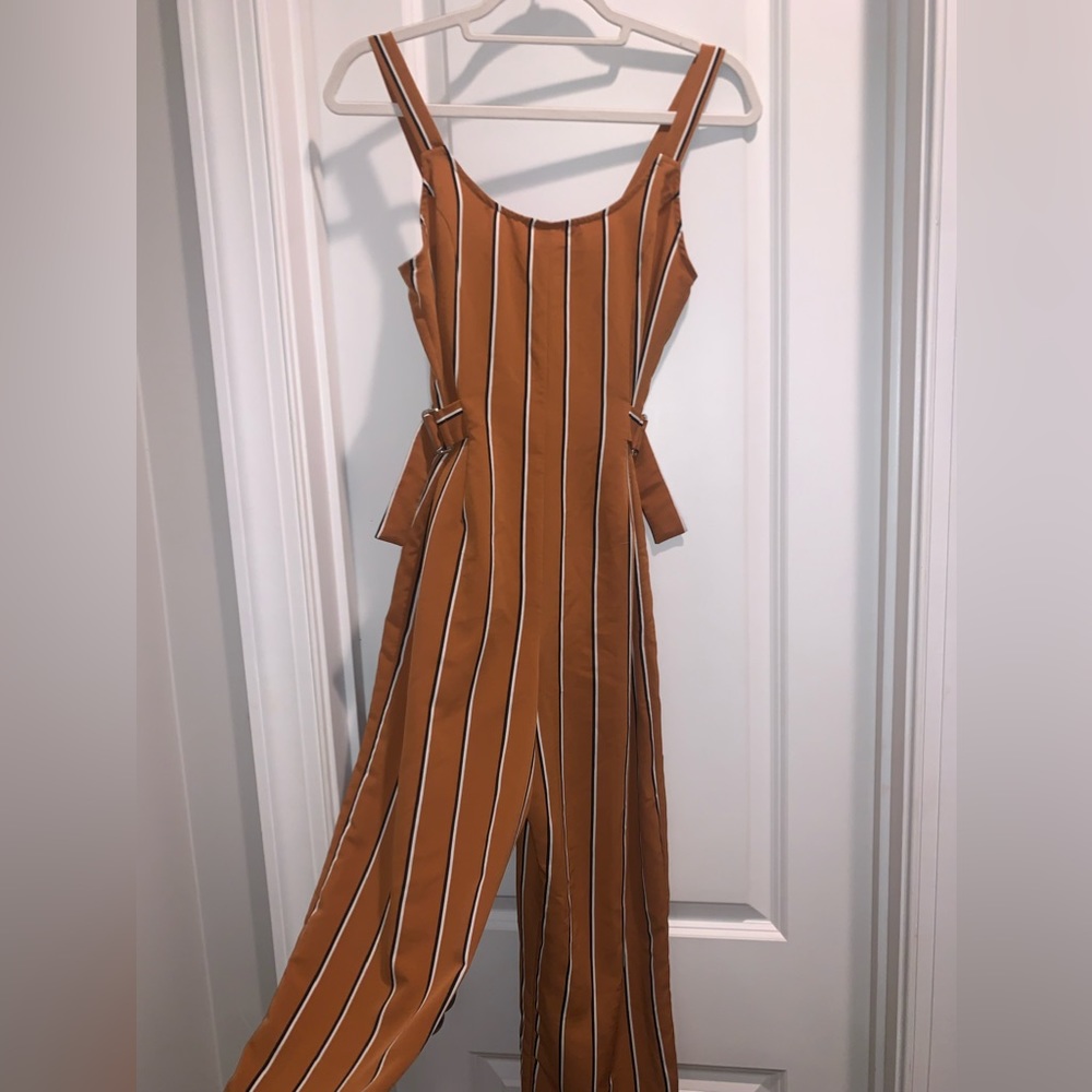 Unique jumpsuit with fun buckles